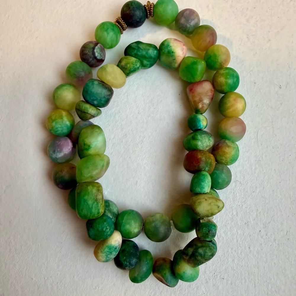 Beautiful handmade bracelets in green-pink tones